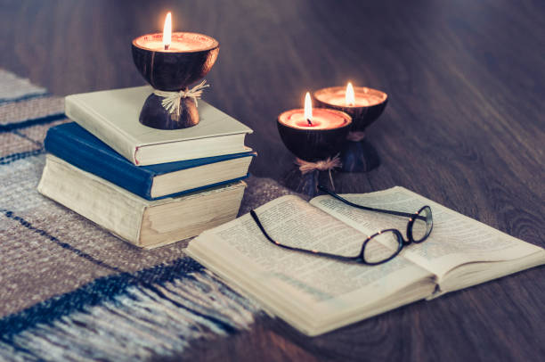 Analog evening activities including books and candles